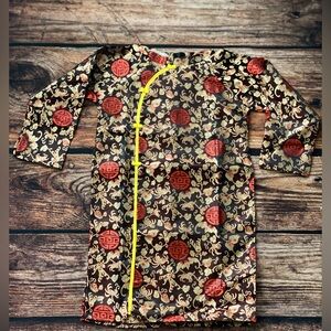 Traditional Patterned Dress with Red and Gold Accents